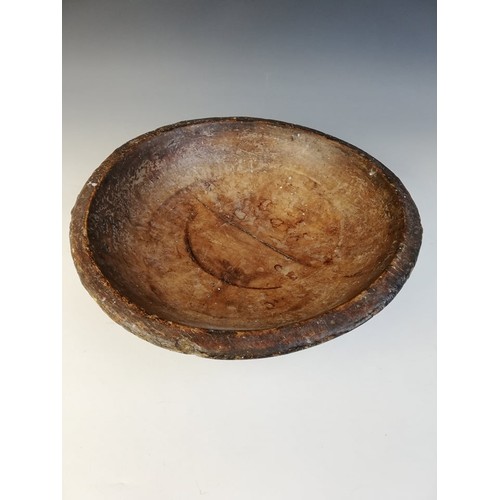 503 - A George III sycamore turned dairy bowl, 40.5cm diameter, an oak dry measure with handle 25.5cm high... 