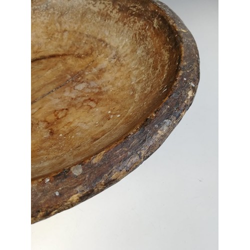 503 - A George III sycamore turned dairy bowl, 40.5cm diameter, an oak dry measure with handle 25.5cm high... 