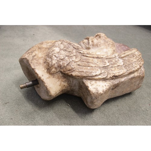 119 - A Roman marble fragmentary trapezophoros (table support) depicting the upper half of a griffin with ... 