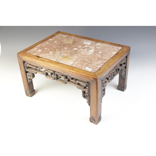 304 - A Chinese hardwood and rouge marble urn stand, of rectangular form with interlinked openwork frieze,... 