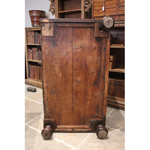 560 - A William and Mary and later figured walnut bureau, in two sections, the feather banded fall front o... 