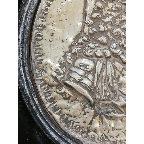 30 - A pair of silver coloured William & Mary commemorative plaques, 18th Century, depicting repoussé pro... 