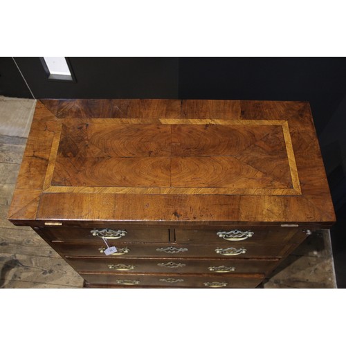 527 - A George II style walnut fold over bachelors chest, the crossbanded folding top above two short and ... 