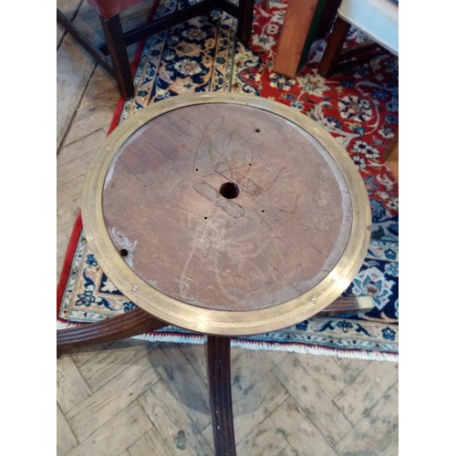 595 - A Regency mahogany and satinwood octagonal drum table, the segmentally veneered top with satinwood b... 