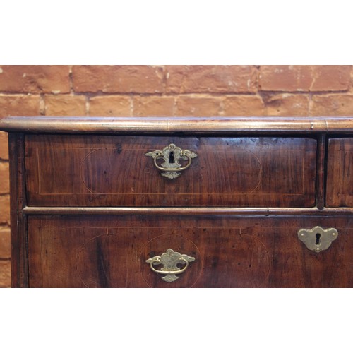 542 - A William and Mary figured walnut chest of drawers, the rectangular crossbanded top inlaid with cord... 