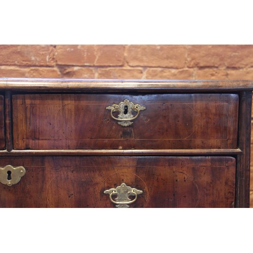 542 - A William and Mary figured walnut chest of drawers, the rectangular crossbanded top inlaid with cord... 