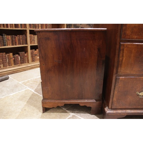 545 - An early 18th century figured walnut bachelors chest of drawers, the rectangular top with a moulded ... 