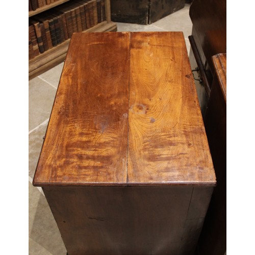 545 - An early 18th century figured walnut bachelors chest of drawers, the rectangular top with a moulded ... 