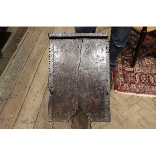 561 - A mid 17th century and later Welsh oak six plank coffer bach, the hinged top with a serrated edge an... 