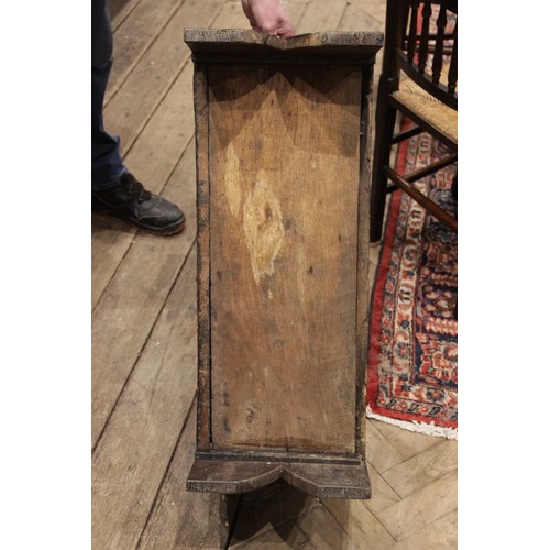 561 - A mid 17th century and later Welsh oak six plank coffer bach, the hinged top with a serrated edge an... 