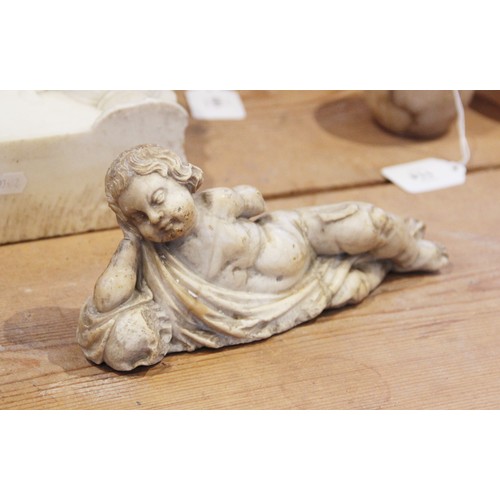 107 - A carved marble fragment depicting a reclining putto with draped material, 22cm long, 10cm high (at ... 