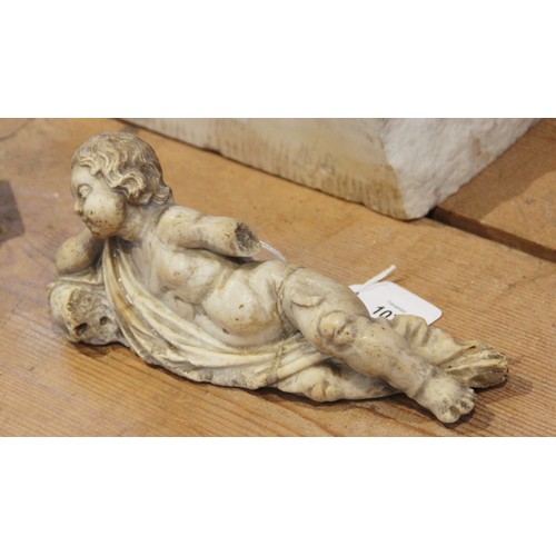 107 - A carved marble fragment depicting a reclining putto with draped material, 22cm long, 10cm high (at ... 