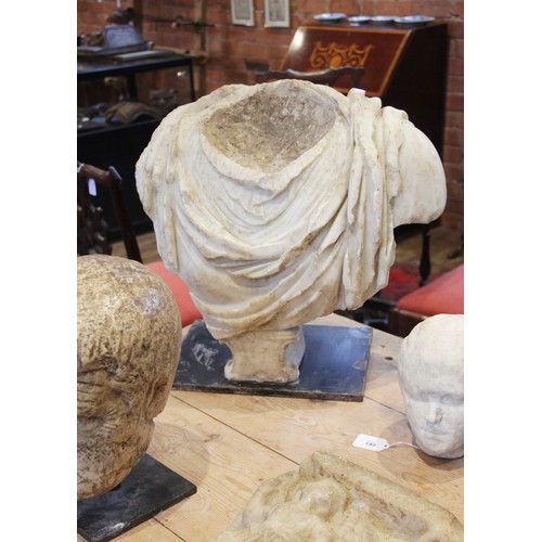 155 - A Roman marble bust with the folds of the tunic deeply carved, set on an integral  tapered socle, ci... 