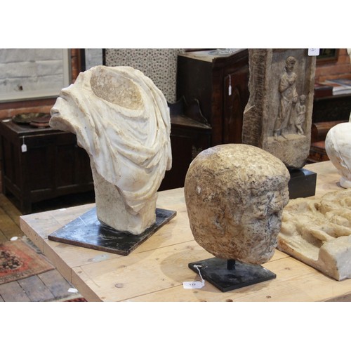 155 - A Roman marble bust with the folds of the tunic deeply carved, set on an integral  tapered socle, ci... 