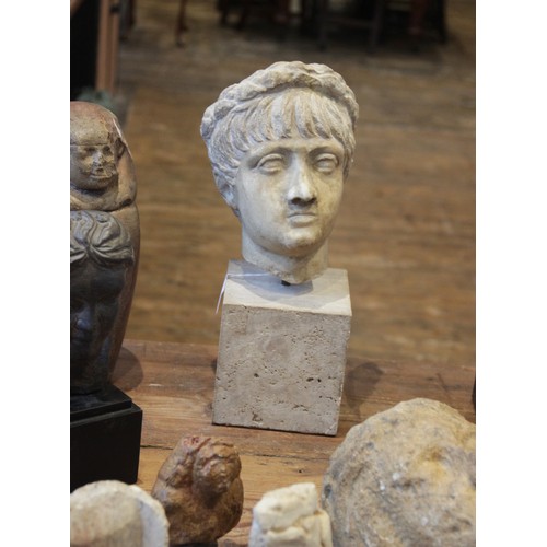 156 - A marble head of an emperor, probably Nero, wearing a wreath, After the Antique, 23.5cm high (at fau... 