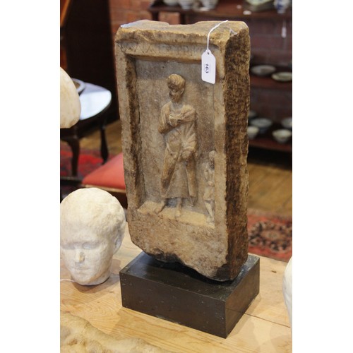 163 - A marble grave stele of rectangular form, the recessed area carved in relief with a standing male fi... 