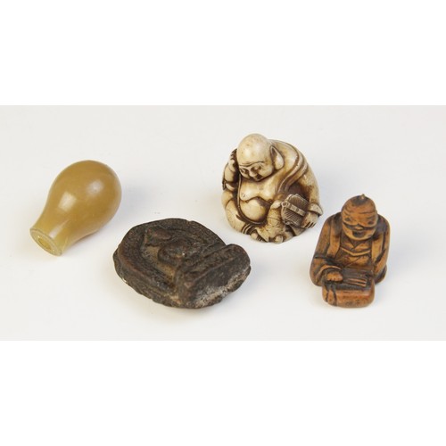 301 - * A selection of Chinese and Eastern objects of virtue, to include a pale jade nail guard, with carv... 