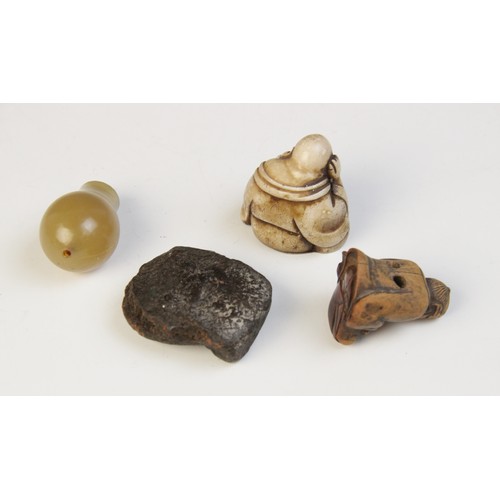 301 - * A selection of Chinese and Eastern objects of virtue, to include a pale jade nail guard, with carv... 