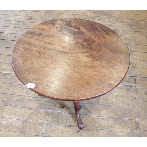 576 - A George III mahogany tilt top tripod table, the circular top raised upon a reduced baluster and rin... 