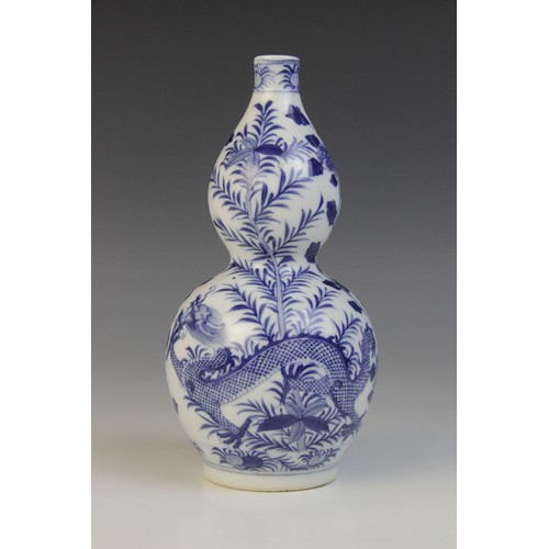 348 - * A Chinese porcelain blue and white gourd vase, 19th century, of double gourd form and externally d... 