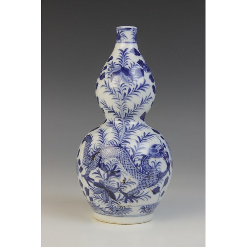 348 - * A Chinese porcelain blue and white gourd vase, 19th century, of double gourd form and externally d... 