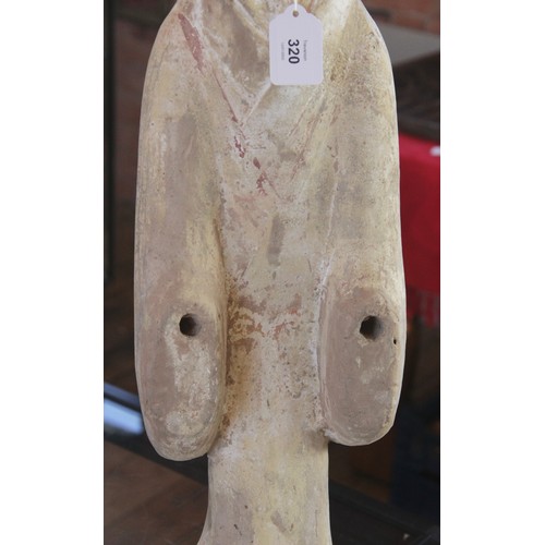 320 - A Chinese pottery Mingqi tomb figure, possibly Western Han dynasty, modelled as a standing Courtesan... 