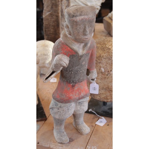 321 - A Chinese pottery warrior, possibly Han dynasty, modelled standing wearing armour and painted in bla... 