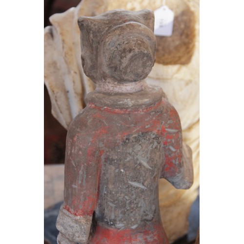 321 - A Chinese pottery warrior, possibly Han dynasty, modelled standing wearing armour and painted in bla... 