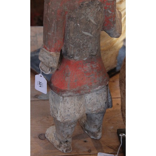 321 - A Chinese pottery warrior, possibly Han dynasty, modelled standing wearing armour and painted in bla... 