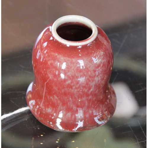 349 - * A Chinese flambe glazed sang de boeuf bitong, in the Qianlong manner, of bell shaped form, unglaze... 