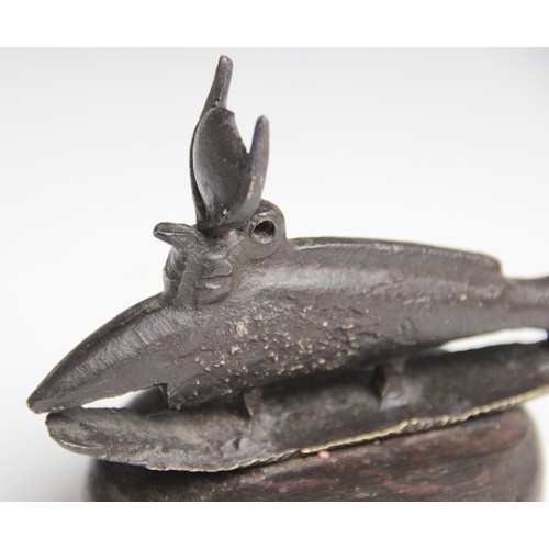 28 - An Egyptian style bronze Oxyrhynchus (medjed fish), modelled as a fish with horned headdress on an i... 