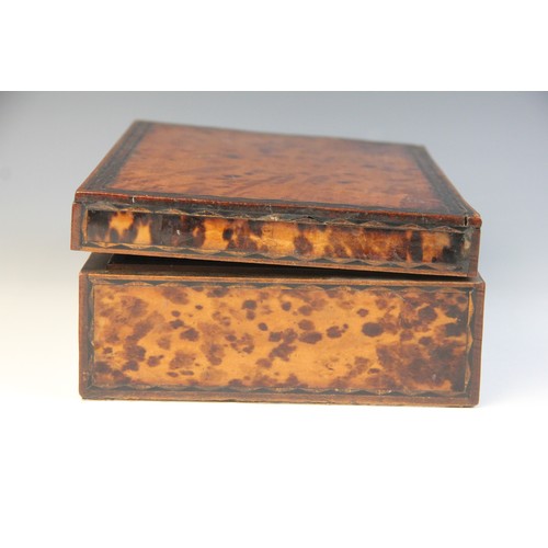 495 - A 19th century burr walnut tea caddy, of rectangular domed form, the hinged cover opening to a centr... 