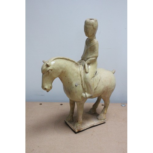 332 - Two Chinese straw-glazed equestrian groups, possibly Sui dynasty, each horse modelled on four legs r... 