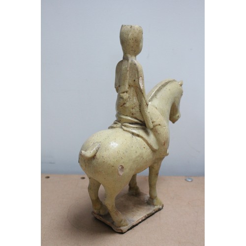 332 - Two Chinese straw-glazed equestrian groups, possibly Sui dynasty, each horse modelled on four legs r... 