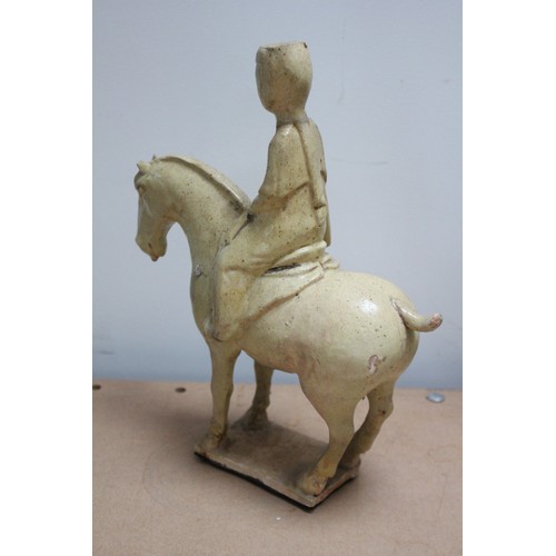 332 - Two Chinese straw-glazed equestrian groups, possibly Sui dynasty, each horse modelled on four legs r... 