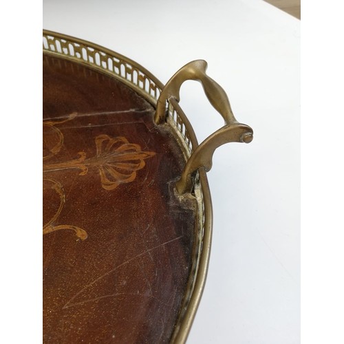 589 - A George III inlaid mahogany oval tray, with a pierced brass gallery and brass side handles, inlaid ... 