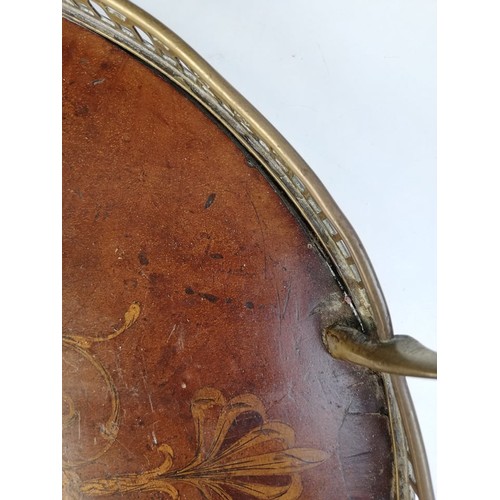 589 - A George III inlaid mahogany oval tray, with a pierced brass gallery and brass side handles, inlaid ... 