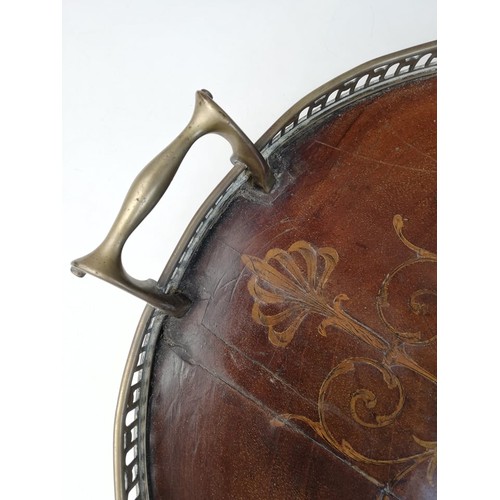 589 - A George III inlaid mahogany oval tray, with a pierced brass gallery and brass side handles, inlaid ... 