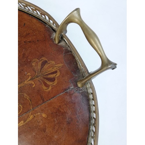 589 - A George III inlaid mahogany oval tray, with a pierced brass gallery and brass side handles, inlaid ... 