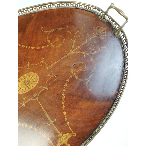 589 - A George III inlaid mahogany oval tray, with a pierced brass gallery and brass side handles, inlaid ... 