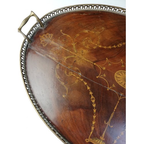 589 - A George III inlaid mahogany oval tray, with a pierced brass gallery and brass side handles, inlaid ... 