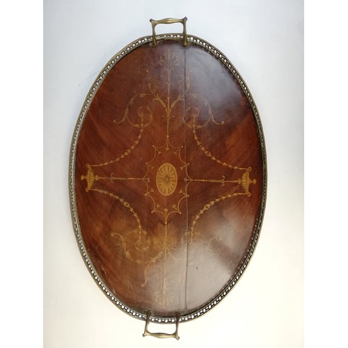 589 - A George III inlaid mahogany oval tray, with a pierced brass gallery and brass side handles, inlaid ... 