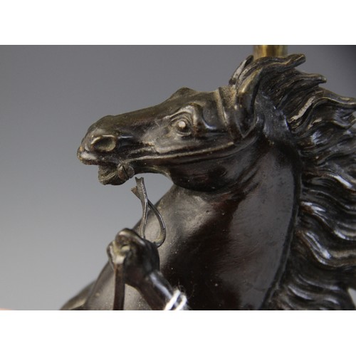 387 - After Guillaume Coustou, a pair of patinated bronze Marly horses, naturalistically modelled rearing ... 