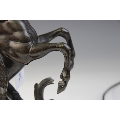 387 - After Guillaume Coustou, a pair of patinated bronze Marly horses, naturalistically modelled rearing ... 