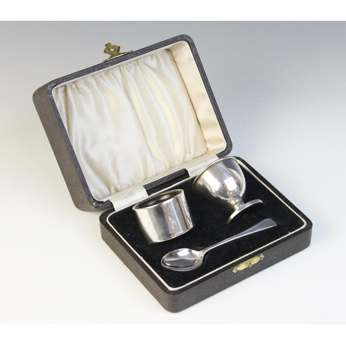 100 - A George VI three piece silver christening set, Joseph Gloster Ltd, Birmingham 1939, comprising an e... 