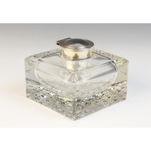 101 - An Edwardian cut glass silver mounted inkwell, Henry Matthews, Birmingham 1901, the square form body... 