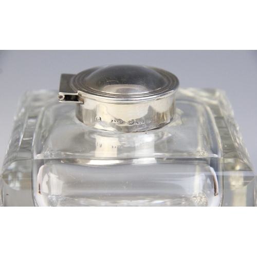 101 - An Edwardian cut glass silver mounted inkwell, Henry Matthews, Birmingham 1901, the square form body... 