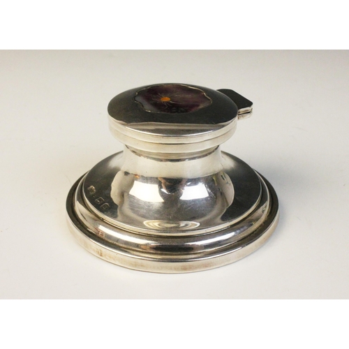 104 - A George V silver mounted miniature capstan inkwell, possible Henry Matthews, Birmingham 1911, of ty... 