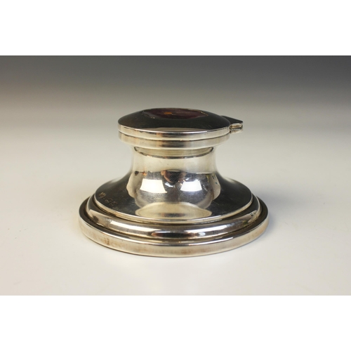 104 - A George V silver mounted miniature capstan inkwell, possible Henry Matthews, Birmingham 1911, of ty... 