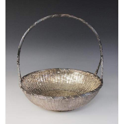 118 - A Christofle silver plated bread bowl, in the form of a circular weaved basket with loop handle, 29c... 